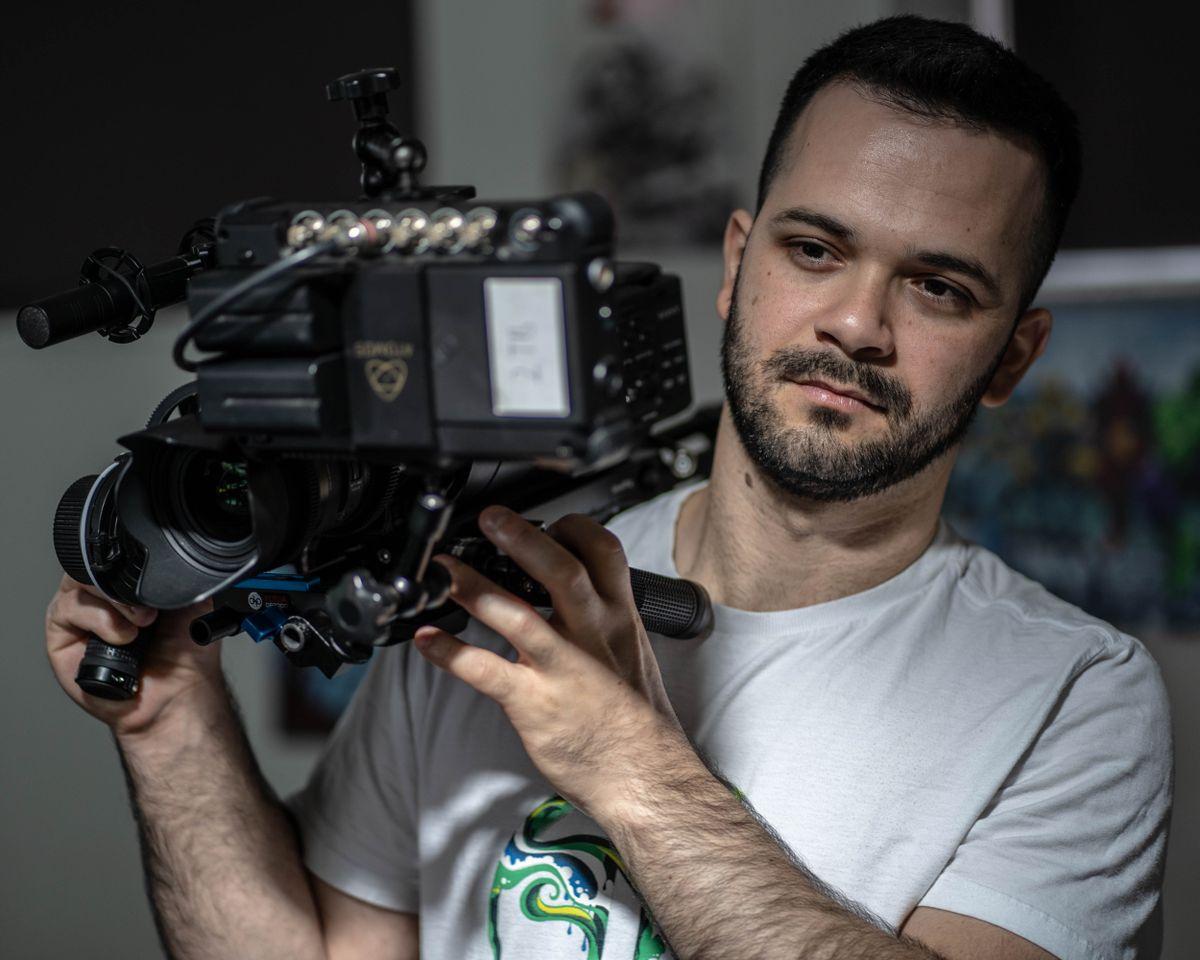 Cameraman carrying a cinema camera rig